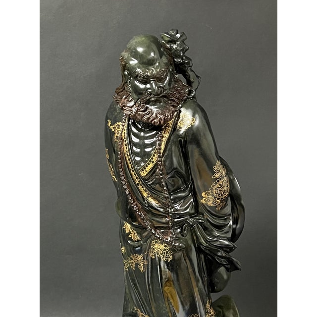 ITEM NAME: Chinese Art Carved Dark Green Soapstone Bodhidharma Sculpture ORIGIN: China AGES: Late 20th Century MATERIALS:...