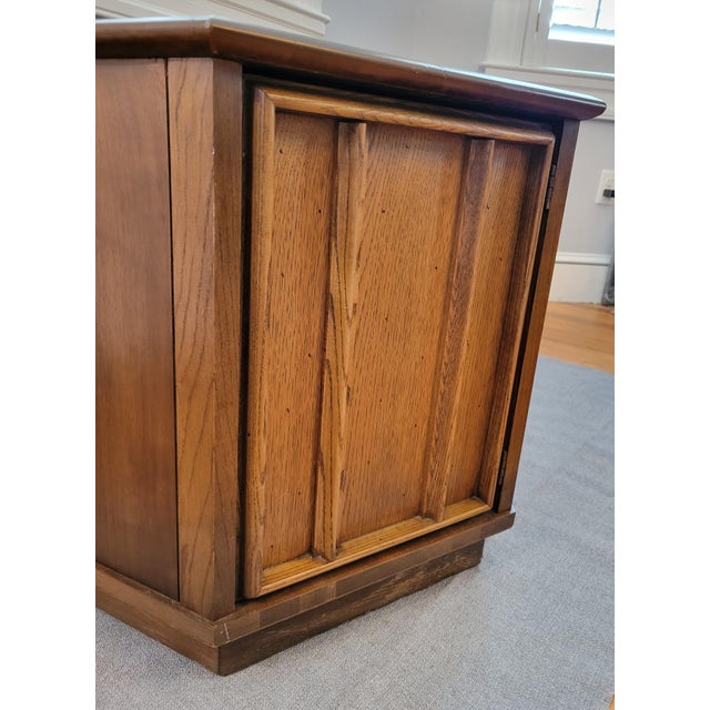 Beautiful mid-century modern hexagonal side table with large cabinet. Walnut top, sides and molding with oak door, which...