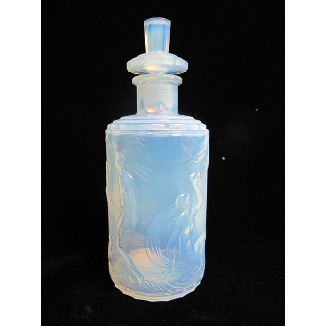 Marius-Ernest Sabino (French, 1878–1961) art deco era glass perfume bottle with stopper. Opalescent glass bottle in tones...