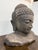 Design Plus Gallery presents a Buddha Bust of Hand-Carved Lava Stone from Indonesia. The top of the Enlightens head are...