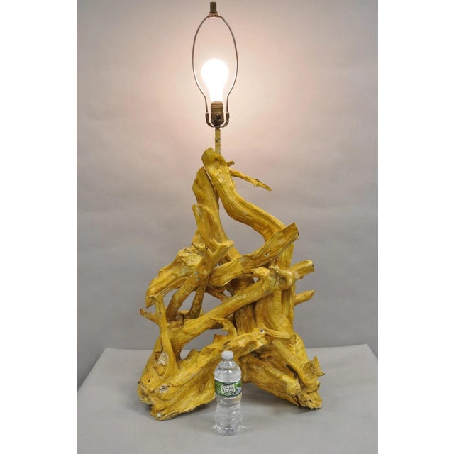 Vintage Mid Century Modern Large Driftwood Yellow Painted Tiki Room Table Lamp. Circa Mid 20th Century. Measurements: 41"...