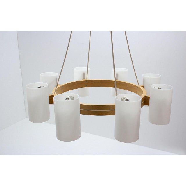 Large chandelier designed by Uno & Östen Kristiansson for their own company Luxus in Sweden during the 1960s. Solid oak...