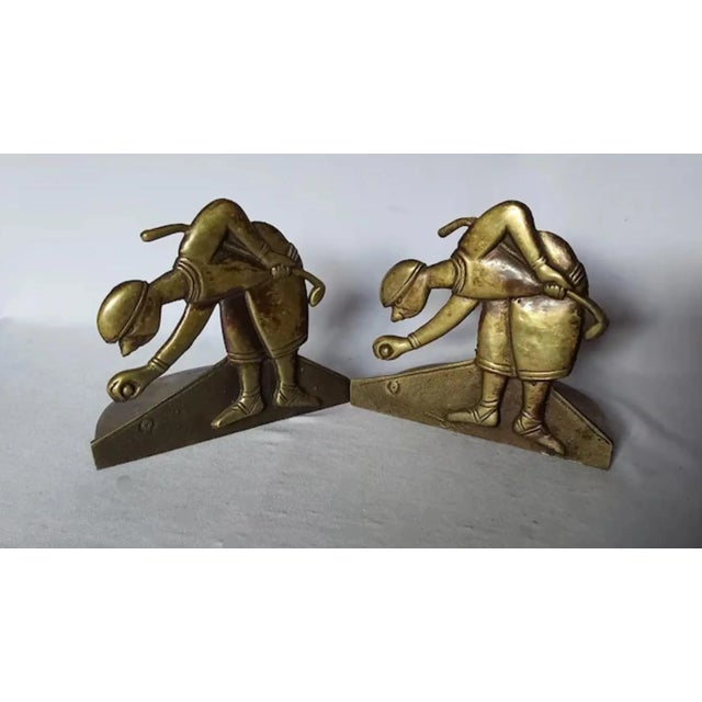 A pair of Antique Art Deco brass bookends by Art Brass Company of NY, the Bookends depict gentleman golfing.