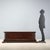 18th century walnut chest from Italy, featuring a dentilated underframe that adds elegance and detail. The front is...
