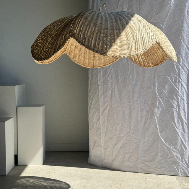 Large rattan pendant light or lampshade in the shape of a flat, woven tulip flower. The high-quality rattan is beautifully...