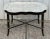 Striking black lacquer faux bamboo style coffee table by Maitland Smith. The black base has subtle gold detail and...