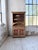 Antique pine grocery cabinet in the savoyard style, featuring polychrome paintwork and motifs, dating from the 1940s. Its...