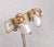 Mid to late 1950s rhodium plated egg-shaped white resin moonglow with curled top and "leaves" around the top "cumquat"...
