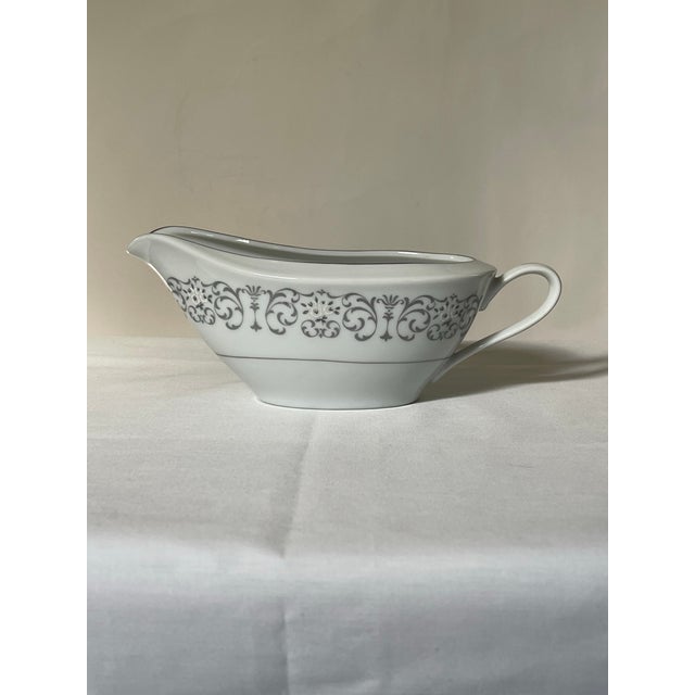 An elegant grey and white scrollwork gravy boat trimmed in silver. Ships within 1-2 days using USPS. All items packed with...