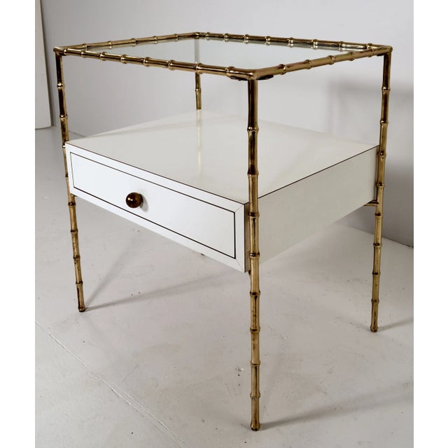 Handsome and unique side table, customized with a center drawer. The solid brass faux bamboo frame was originally a simple...