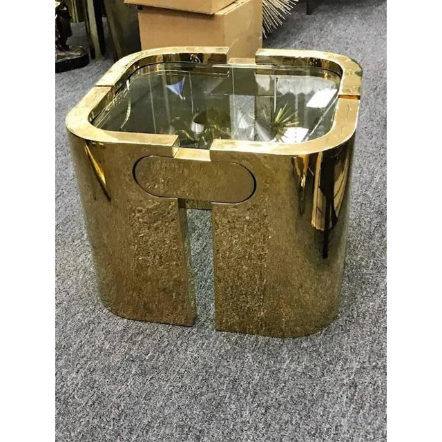 Substantial and heavy gold-plated bronze table custom designed in the 1970s. Interlocking puzzle design fitted like a...
