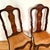 An antique pair of 19th century Dutch marquetry side chairs with mother-of-pearl accents. Each chair back is intricately...