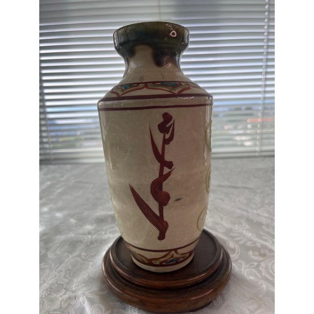 Up for sale is a beautiful antique Chinese porcelain vase featuring hand-painted floral motifs and a unique blue...