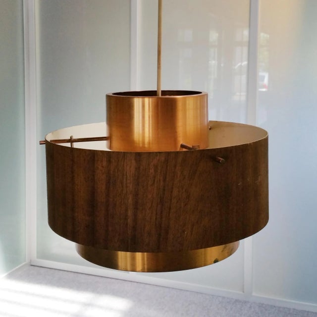 This pendant lamp is reminiscent of the designs by Jo Hammerborg. It is made from red copper with a veneer on copper outer...