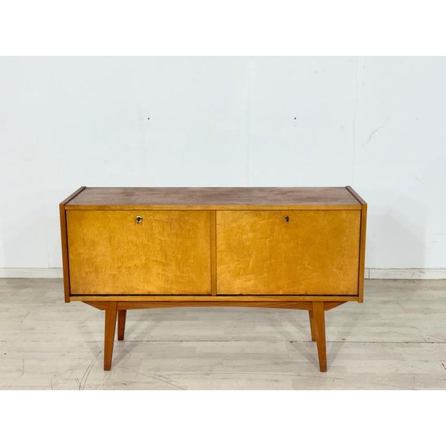 For sale is a very beautiful mid-century modern chest of drawers from the 1960s. This piece of furniture impresses with...