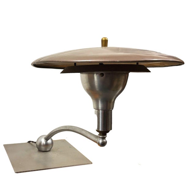 This "Sight Light" manufactured by M.G. Wheeler features a curved neck and with a body composed of brass with enameled...