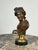 This antique small bronze bust of the Apollo Belvedere reflects the enduring fascination with classical antiquity that...