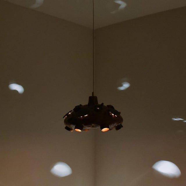 Stunning round hanging lamp with an unusual shape, made with rich cognac colored blue ceramics, manufactured in the 1970s...