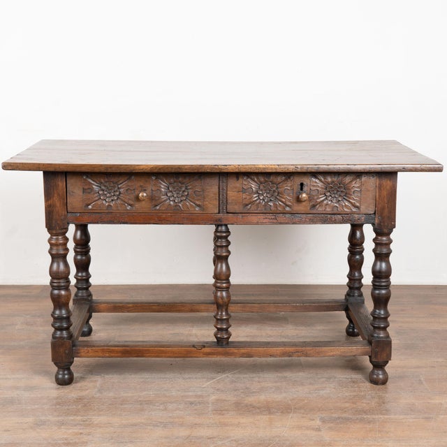 Early 19th century Portuguese carved console table, crafted in chestnut. The table features two beautifully carved drawers...
