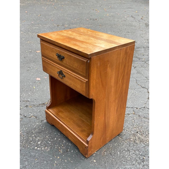 Bring classic mid-century craftsmanship and warmth to your bedroom with this vintage nightstand produced by the L.A....