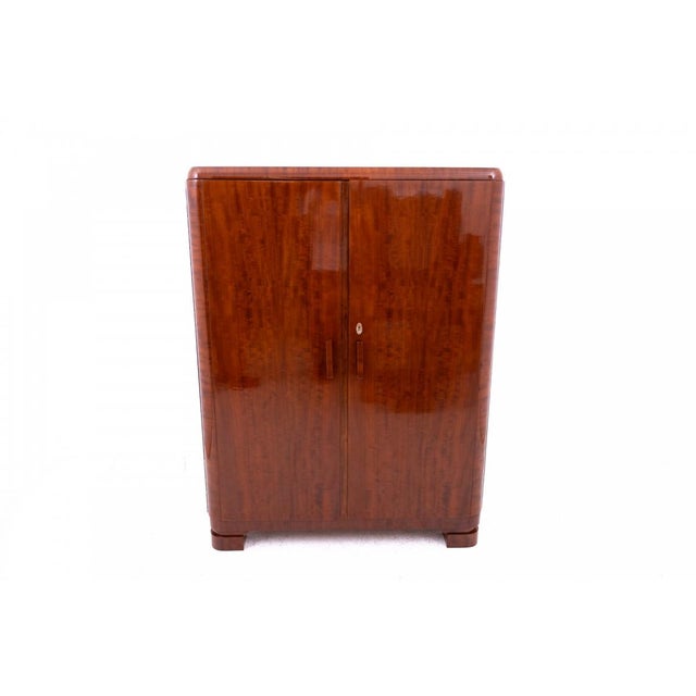 Art Deco wardrobe from the 1930s, Poland. In very good condition, after professional renovation. The wardrobe has a high-...