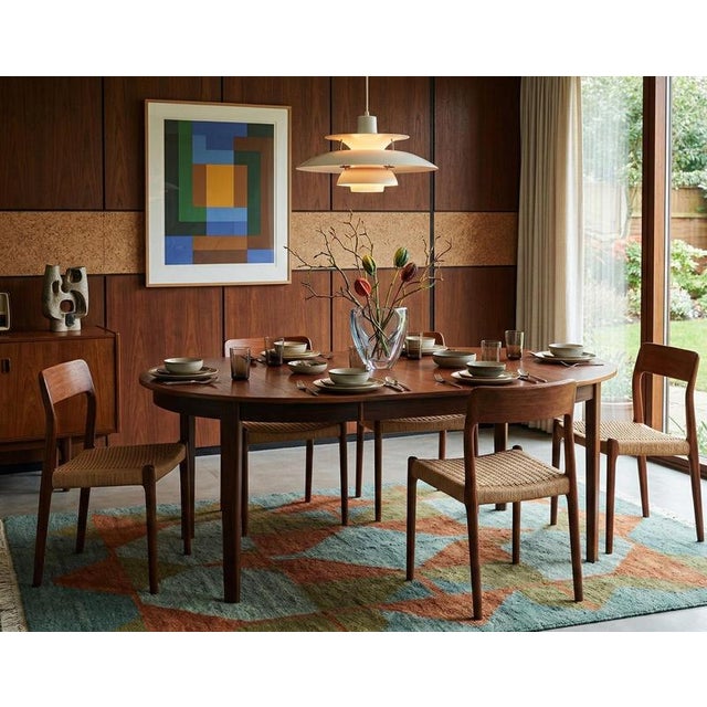 Produced in Denmark in the 1960s, this elegant dining table is crafted in beautifully figured rosewood, showcasing rich...