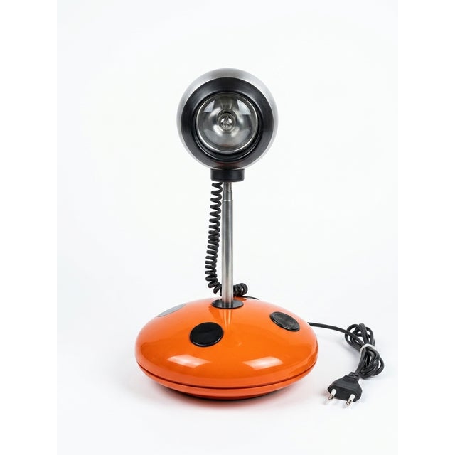 "The lamp is telescopic; its maximum height is 36 cm and its minimum height is 26 cm." This piece has an attribution mark,...