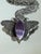 Vintage statement pendant necklace featuring a large silver tone butterfly suspended from a substantial opera length...
