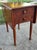Beautiful antique drop-leaf side table with two dovetailed drawers. The leaves rely on wooden braces to be upright, rather...