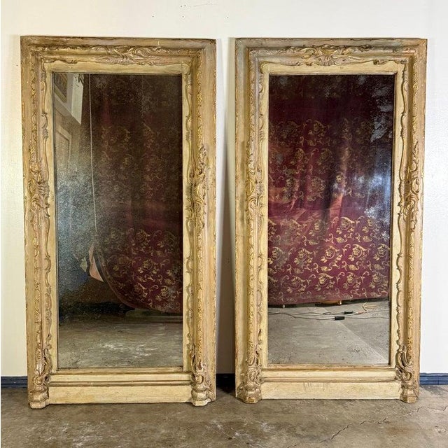 Pair of Monumental 19th Century Italian Door Surround Mirrors with Antique Glass. This striking pair of monumental mirrors...