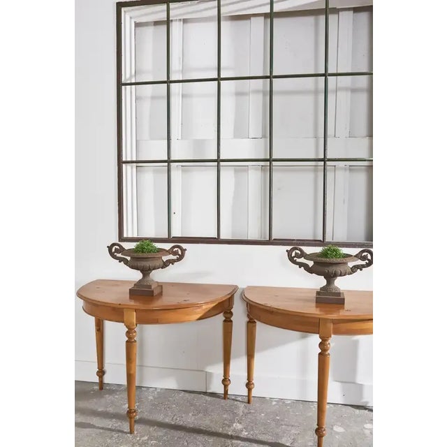 Charming pair of diminutive scale English cast iron urns or jardinaire planters. Made in the neoclassical taste with...