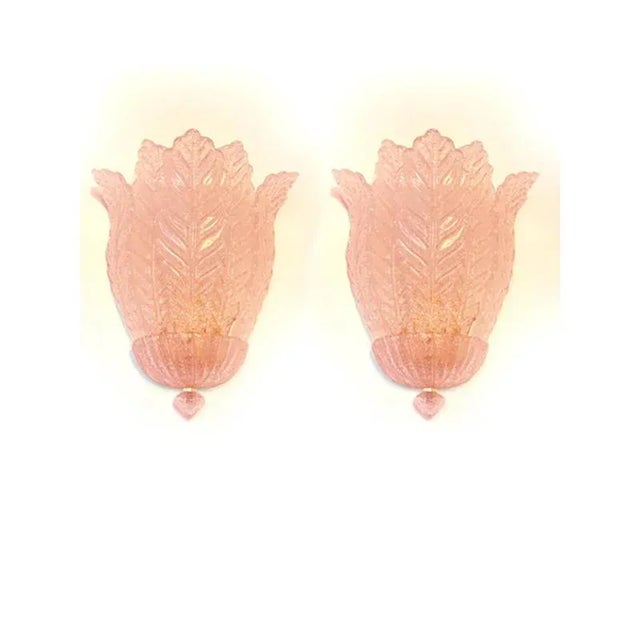 Set of two pink venetian wall sconces, made in trasparent “graniglia” with a touch of contemporary pink color. the glass...