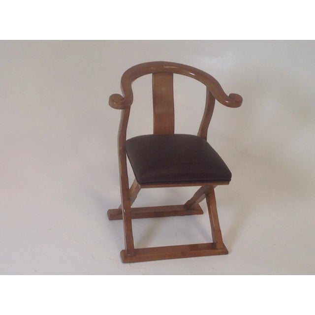 Unique accent chair. Chair has a light walnut finish and is in excellent condition. The dims are 32" tall 25" wide and 21"...