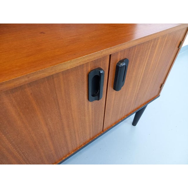 Vintage shelving library of the 60s, Scandinavian style, teak, compasal feet, sides, handles and base painted in black, 2...