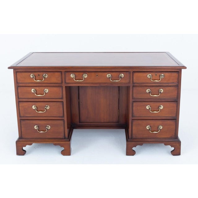 Georgian mahogany desk This desk stands upon bracket feet Period Georgian antique Having an arrangement of 9 oak lined...