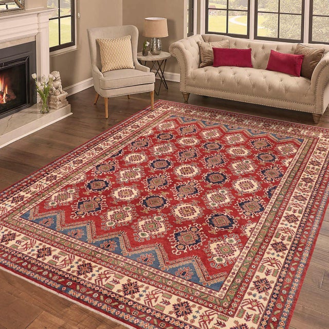 Enhance your home with this exquisite hand-knotted Super Kazak rug, crafted from fine hand-spun wool and dyed with all-...
