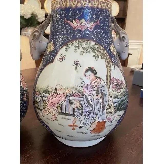 Offered is a vintage pair of large chinoiserie theme cachepots. This set features beautiful soft feminine colors and...