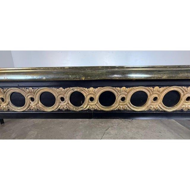 A striking and exceptionally long French Louis XVI–style oval dining table, beautifully crafted with an elegant...