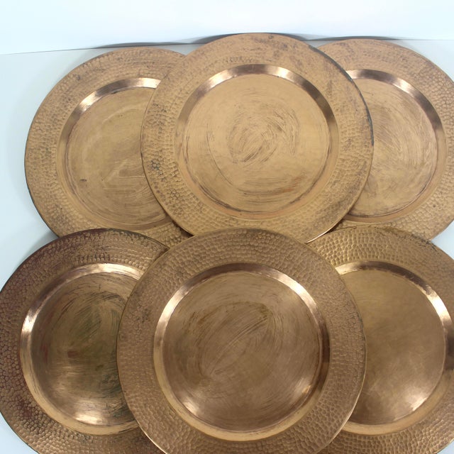 Set of six copper chargers with hammered rims. Could also be used as drinks, serving or decorative trays. These are heavy.