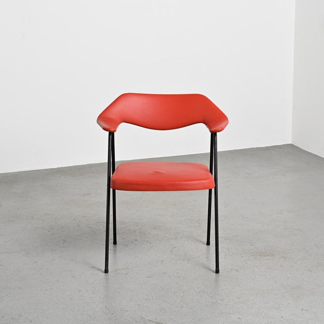 Model 675 armchair designed in the 1950s by Robin and Lucienne Day and produced by Airborne in France. The armchair rests...