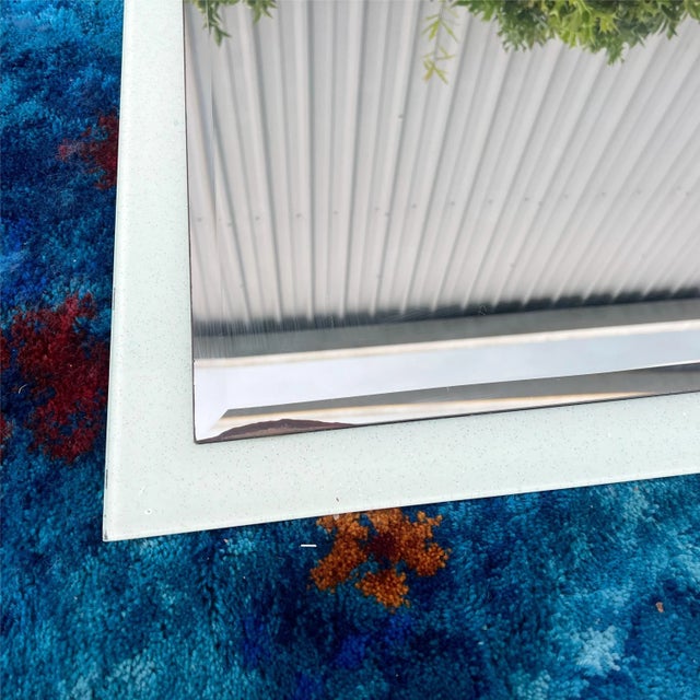 This mirror just doesn’t photograph well, but it is super cool! It’s a very soft blue with sparkles and the mirror itself...