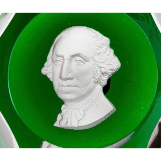 A finely crafted mid-20th century French crystal sulfide paperweight, engraved “Baccarat 1954”, featuring a detailed cameo...