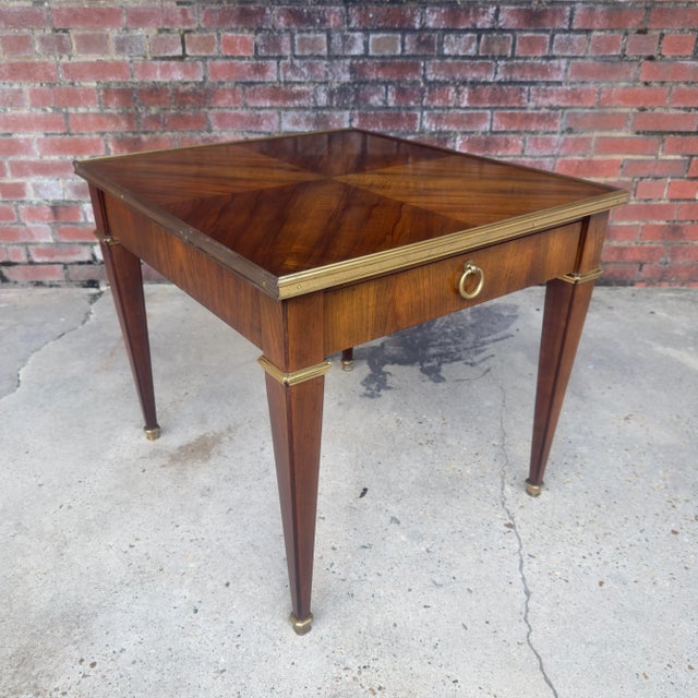 * Discover the perfect blend of elegance and functionality with this exquisite Vintage Baker Furniture Neoclassical Walnut...