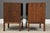 A pair of mid century modern walnut single drawer nightstands with rosewood drawer pulls and brass accents designed by...