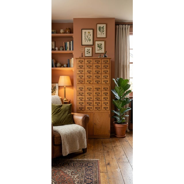 The cabinet features 36 small drawers arranged in a 4x9 grid, originally used to store index cards, paper documents,...