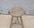 A charming vintage Chinese stool crafted from solid elmwood, dating to the first half of the 20th century. The thick round...