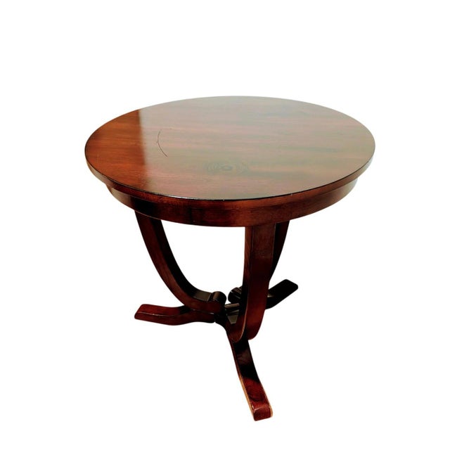 Round Mahogany Pedestal Table This is a beautiful round wooden pedestal table made of mahogany, designed as a classic...