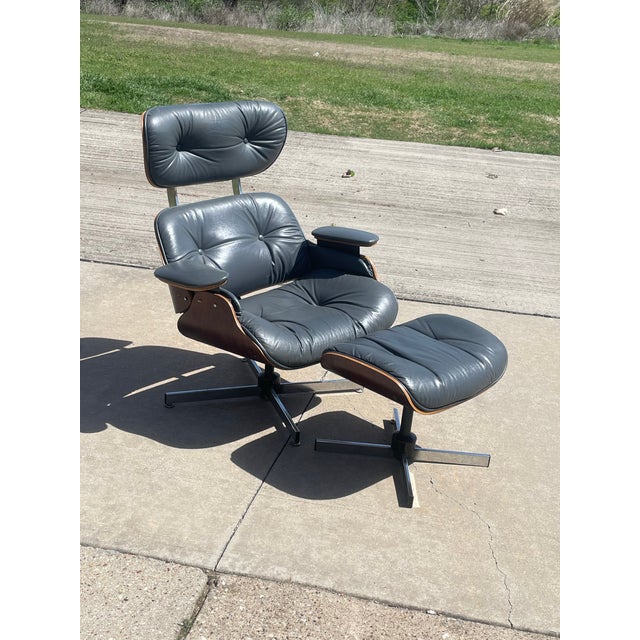 EAMES STYLE PLYCRAFT CHAIR AND OTTOMAN Plycraft chair and ottoman after Eames, chair with original Plycraft label and...