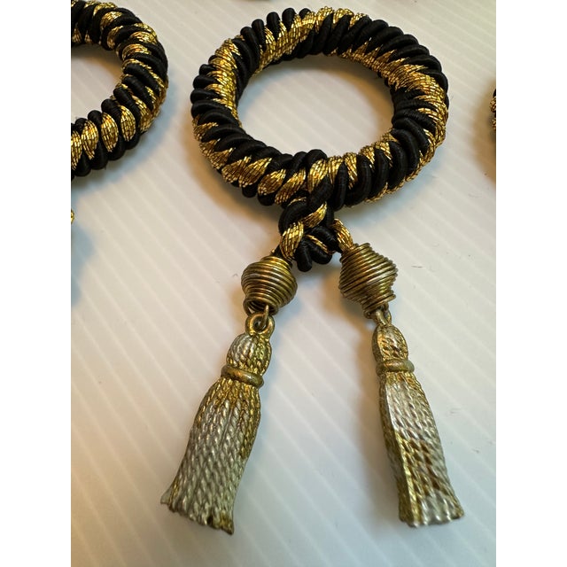 10 vintage black and gold ornate elegant napkins holders with a worn gold tone tassel, they are beautifully designed with...