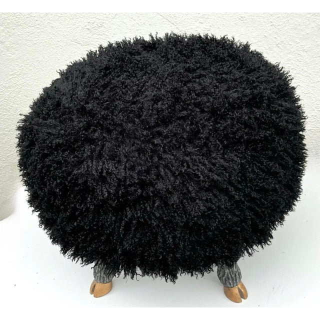 Delightful “faux mongolian lamb” upholstered round ottoman or stool, with carved and hand-finished “sheep” legs and 14k...